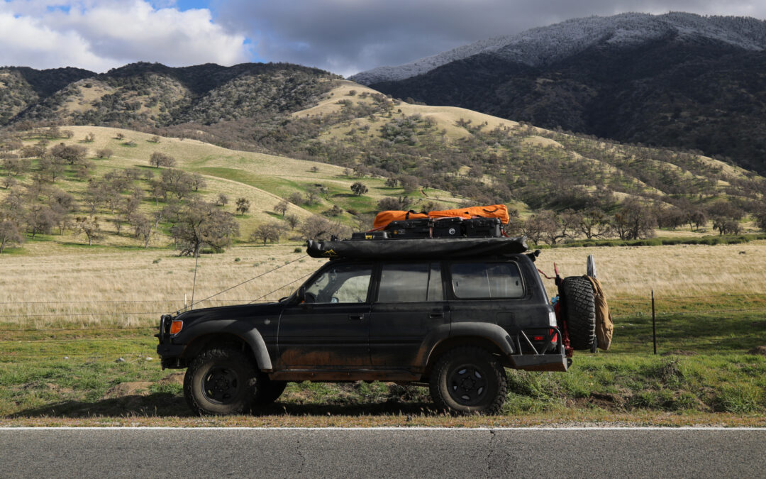 Overland on a budget vehicle sitting on the side of the road