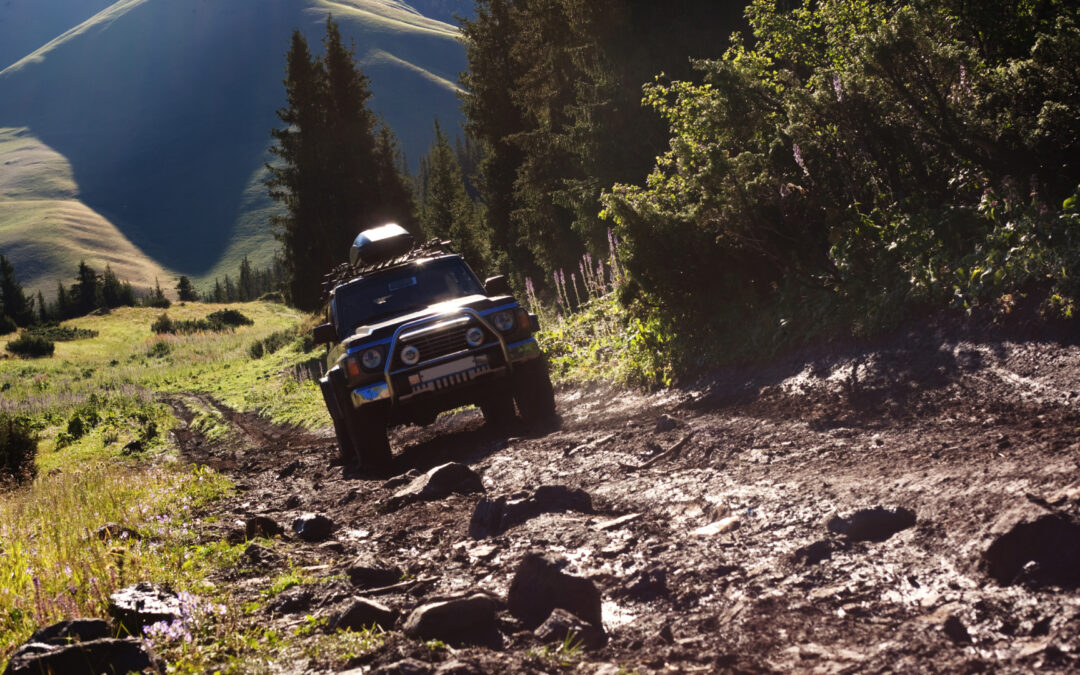 Vehicle climbing up steep and rocky hill